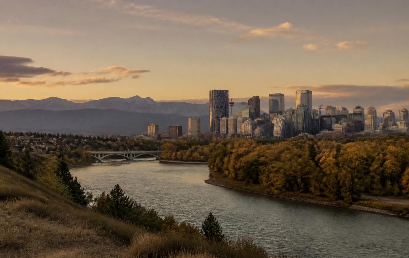 Calgary skyline and the Alberta foothills at golden hour